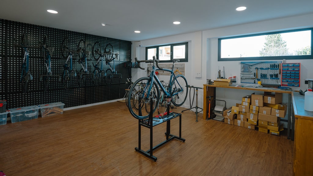 Luxcom workshop with a bike on the repair stand